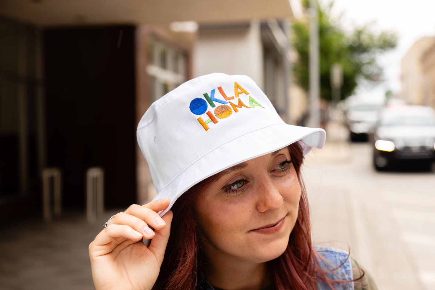 Model Atlantis Headwear Stacked Modern Oklahoma Bucket Hat